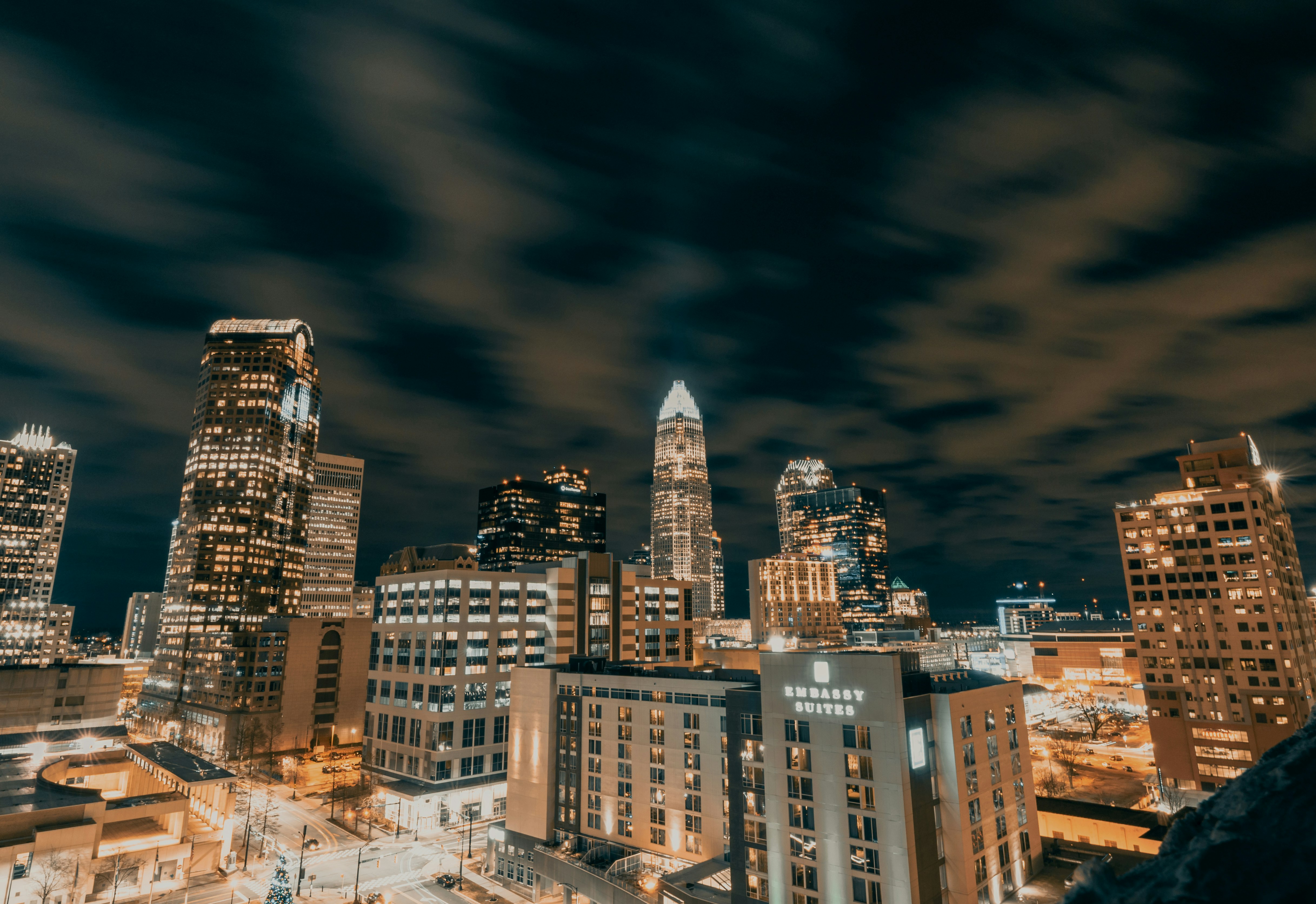 city skyline under gray cloudy sky during daytime